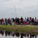 Spectators watch the Space Shuttle Atlantis blasting off on July 8, 2011. The launch was the 135th and final Space Shuttle launch for NASA.